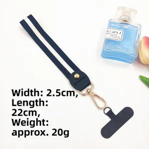 Close-up of navy blue striped polyester wrist strap with golden metal spring buckle