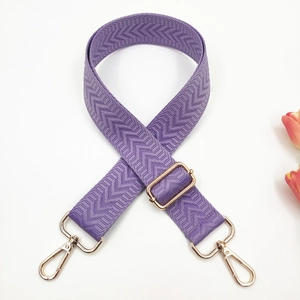 Adjustable purple nylon strap with herringbone pattern and gold metal lobster clasps