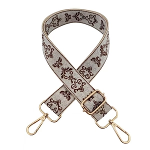 Detailed view of bohemian floral jacquard strap with gold-plated zinc alloy buckles