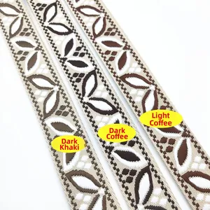 Detailed embroidery of floral leaf patterns on high-density canvas bag straps in three colors