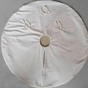 White Christmas tree skirt with elegant pearl bow accents and beaded trim decoration