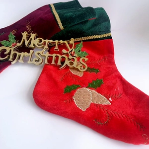 Embroidered Christmas stockings in red and green velvet with Merry Christmas text