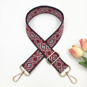 Adjustable 3.8cm wide woven strap with red geometric pattern and gold metal hooks