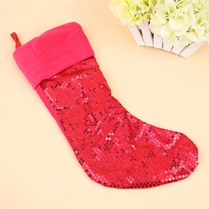 Festive red sequin Christmas stocking with soft plush cuff and convenient hanging loop