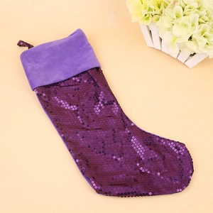 Close-up of a purple sequined Christmas stocking with soft plush cuff and hanging loop