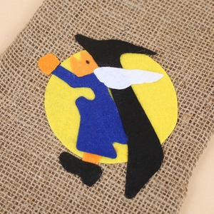 Linen Halloween gift bag with moon and wizard felt applique on a smooth background
