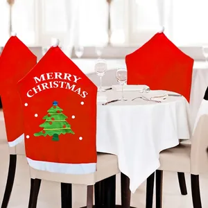 Red Christmas chair covers with Merry Christmas text and white pom pom accents