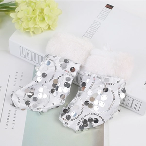 Sparkly white sequin Christmas stockings with faux fur trim for festive holiday decorations
