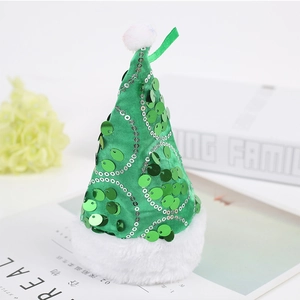 Close-up of green sequined Christmas hat ornament with white plush ball and trim