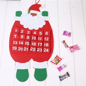 Christmas Santa felt advent calendar with 24 storage pockets on white wood background