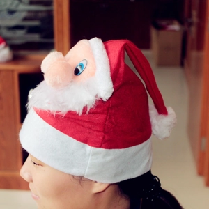 Detailed side view of a plush Christmas hat featuring a 3D cartoon Santa Claus with a large nose
