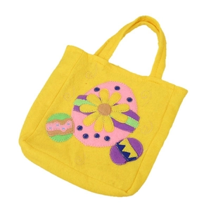 Sac cadeau de Pâques en feutre jaune avec des œufs colorés et une applique de fleur de marguerite