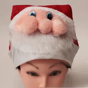 Detail of plush Santa Claus hat featuring 3D nose and fluffy white beard for Christmas