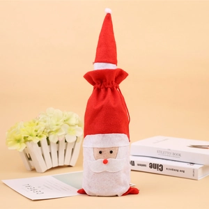 Handmade Santa Claus wine bottle cover with red felt hat and beard for Christmas decor