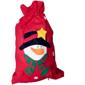 Close-up of a festive red Christmas gift bag featuring a cute snowman with a striped scarf