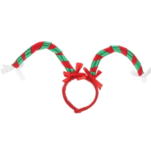 Detail of festive Christmas headband with red velvet frame and green ribbon spiral horns