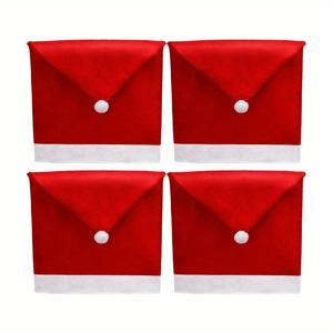 Set of four red and white Santa hat chair covers with fuzzy pom-poms for Christmas decor