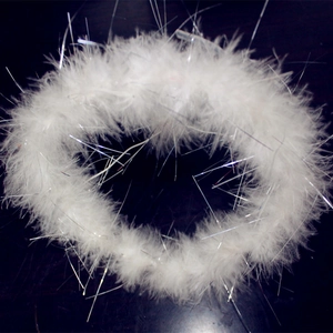 Detailed view of white feather angel halo headband with silver glitter tinsel accents