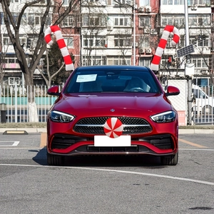 Christmas car decoration set with candy canes and red ball on a luxury vehicle