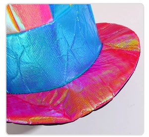 Macro shot of vibrant holographic clown hat showing metallic mesh texture and rainbow colors