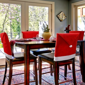 Christmas Santa hat chair covers in red non-woven fabric for dining room holiday decor