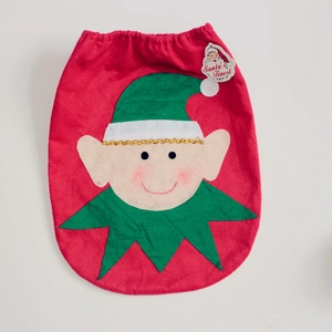 Christmas elf themed red felt gift bag with green hat and Santa's Finest tag