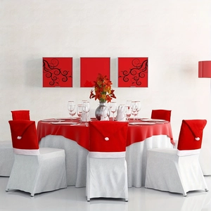 Christmas Santa hat chair back covers in red and white fabric for holiday dining decor