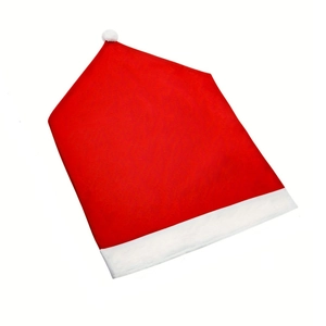 Festive red non-woven Christmas hat chair cover with white plush pompom and trim
