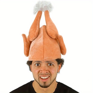 Detail of plush Thanksgiving turkey hat with LED lights and 3D chicken legs on white background