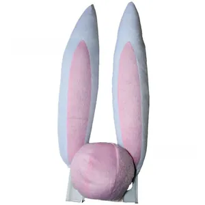 Detail of plush pink and white bunny ears car decoration with soft texture and fur ball base