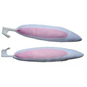 Detailed view of plush white and pink bunny ears for car decor with plastic attachment clips