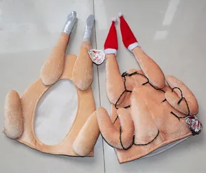 Close-up of funny roasted turkey hat with LED lights and plush Christmas leg details