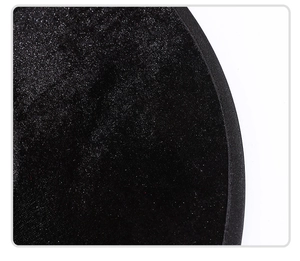 Detail view of high-quality black velvet witch hat with neat curved fabric edge binding