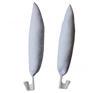 Detail of white plush bunny ears for car decor featuring secure white plastic clip attachments