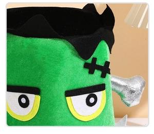 Detail of Frankenstein monster plush bucket with embroidery and silver bolt accents