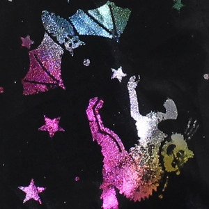 Detail of black fabric with laser rainbow bats and stars print for Halloween witch hat