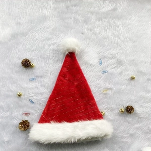 Thick red and white plush Christmas hat with gold tinsel stripes and white pompom