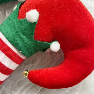 Décor de chapeau d'elfe de Noël et pantalon rouge avec bottes en velours et clochettes