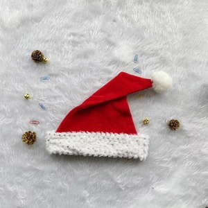 Classic red Christmas hat with white faux fur trim and shiny silver sequins detail