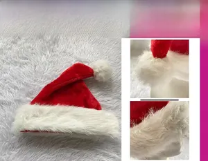 Close-up of plush red velvet Santa hat featuring a thick faux fur pompom and soft white brim