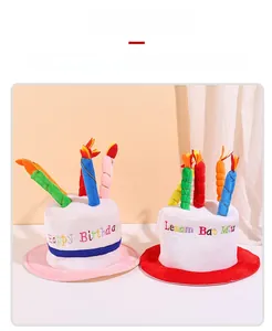 Detail of colorful plush birthday cake hats with candles and embroidered festive text