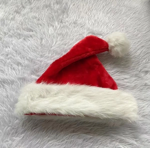 Detailed view of the thick plush texture and soft white pom-pom on a classic Xmas hat
