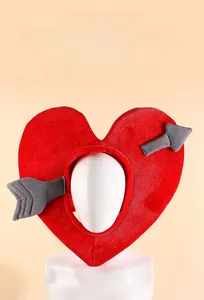 Close-up of red heart plush headgear with Cupid arrow detail on a white mannequin head