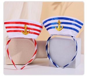 Detail of sailor style headbands with anchor emblems and nautical stripes in red and blue