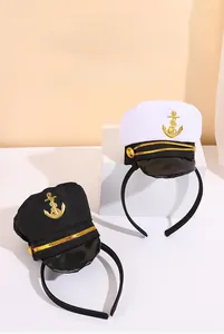 Detail of black and white navy captain headbands with golden anchor logo for costume parties