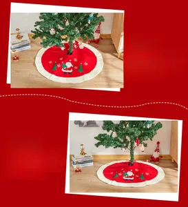 Detail of red Christmas tree skirt with high-end embroidery of Santa and snowflakes