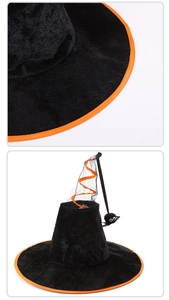 Detalle de sombrero de bruja de terciopelo negro con borde naranja y araña de peluche