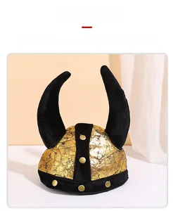 Detail of Viking helmet hat with metallic gold coating and large black horns