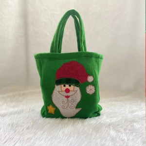 Green Christmas felt gift bag featuring a Santa Claus applique and star decorations