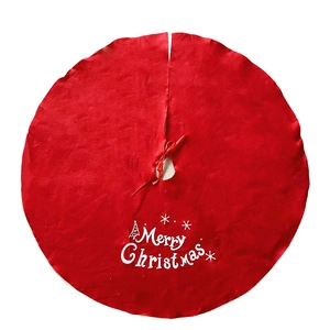 Classic red Christmas tree skirt with Merry Christmas text and snowflake patterns